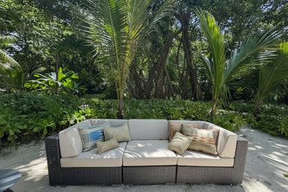 Coastal woven pandan cushions styled against linen — Kapalua Living