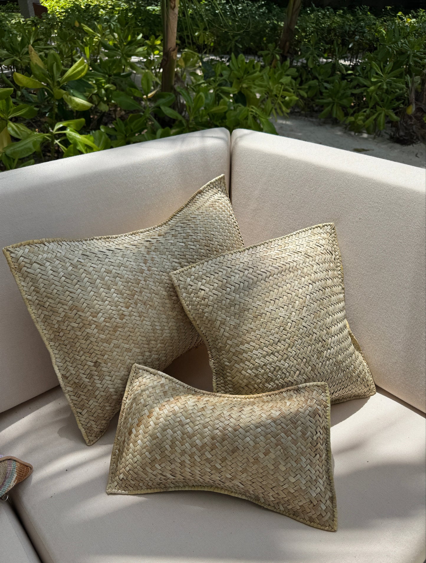 Handwoven pandan throw pillows in natural ivory fibre — Kapalua Living
