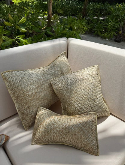 Handwoven pandan throw pillows in natural ivory fibre — Kapalua Living