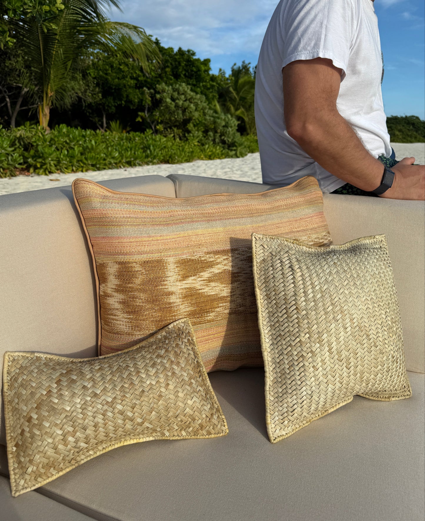 Woven pandan bolster, square and lumbar throw pillows together — Kapalua Living