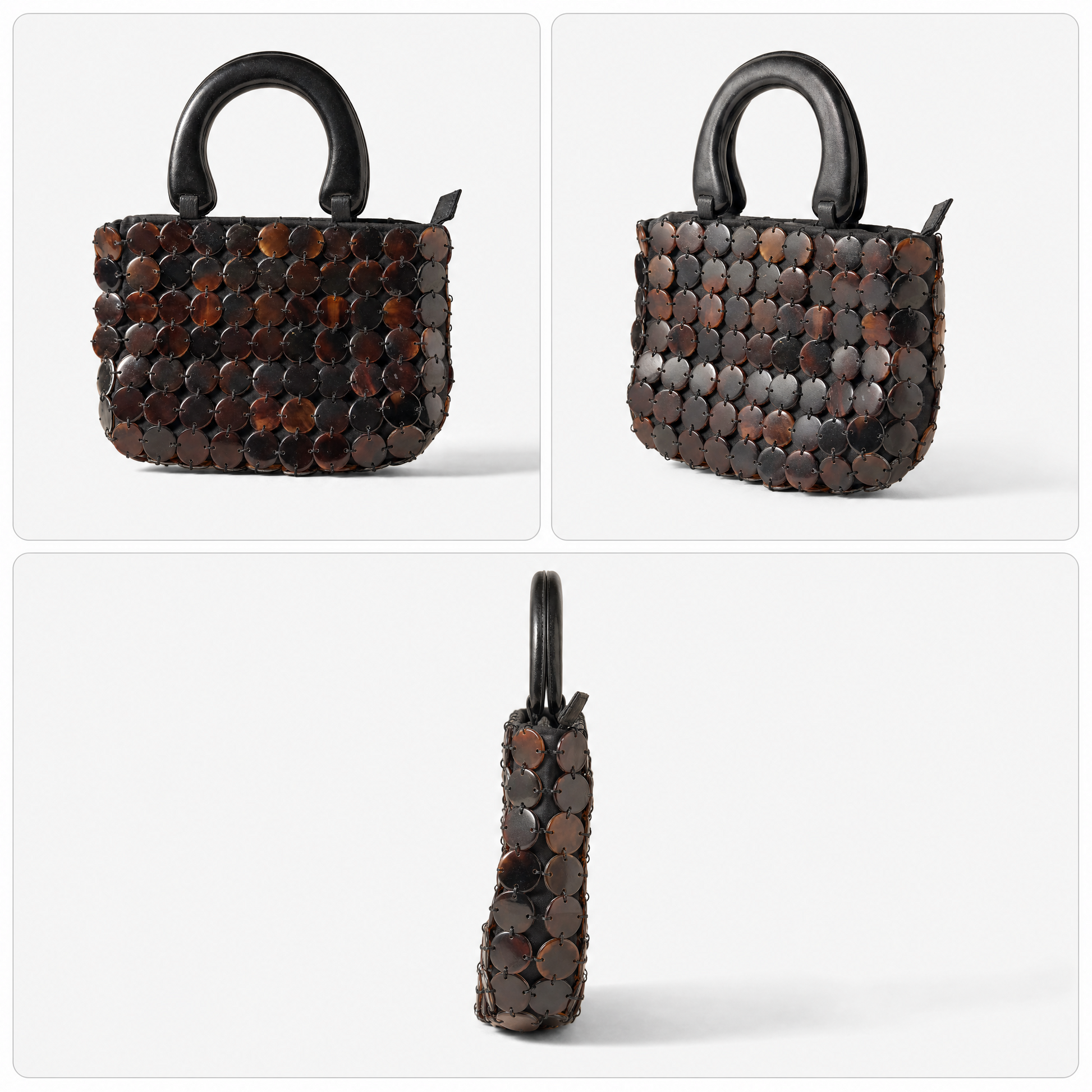 The Marlowe shell bag carried by its carved wooden handle, small enough to pack flat and take travelling.